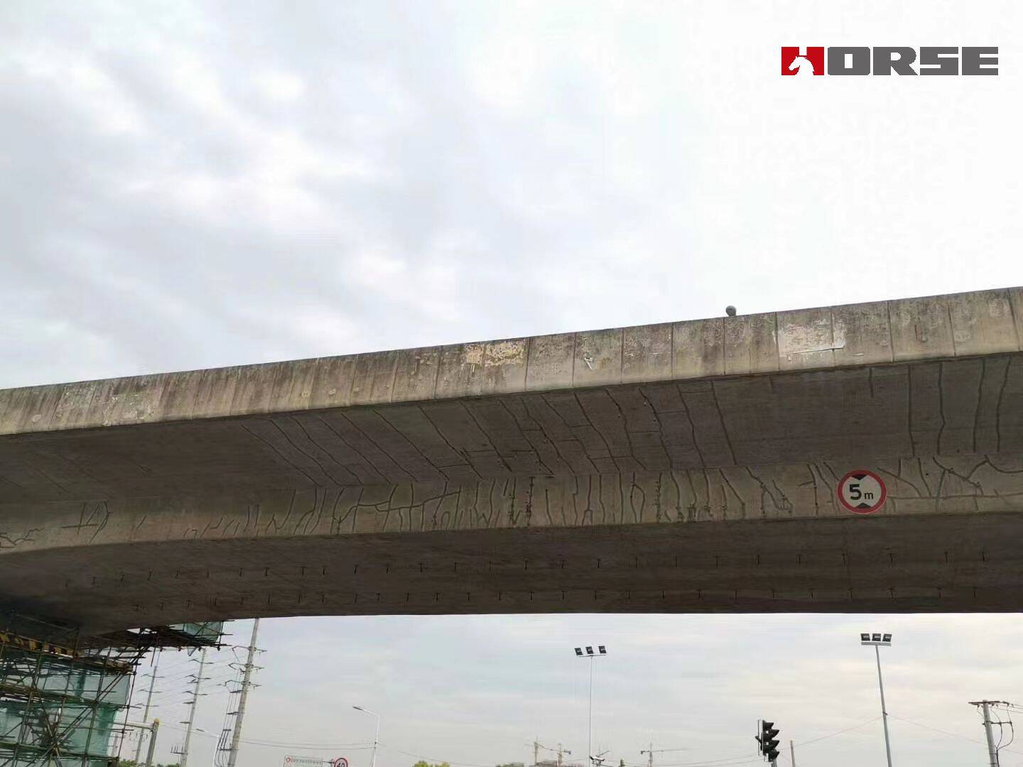 Strengthening of Vertical Cracks in Concrete Bridges with Prestressed CFRP Plates